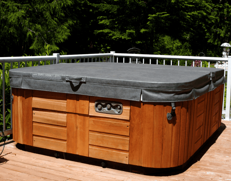 an old outdoor hot tub ready for disposal